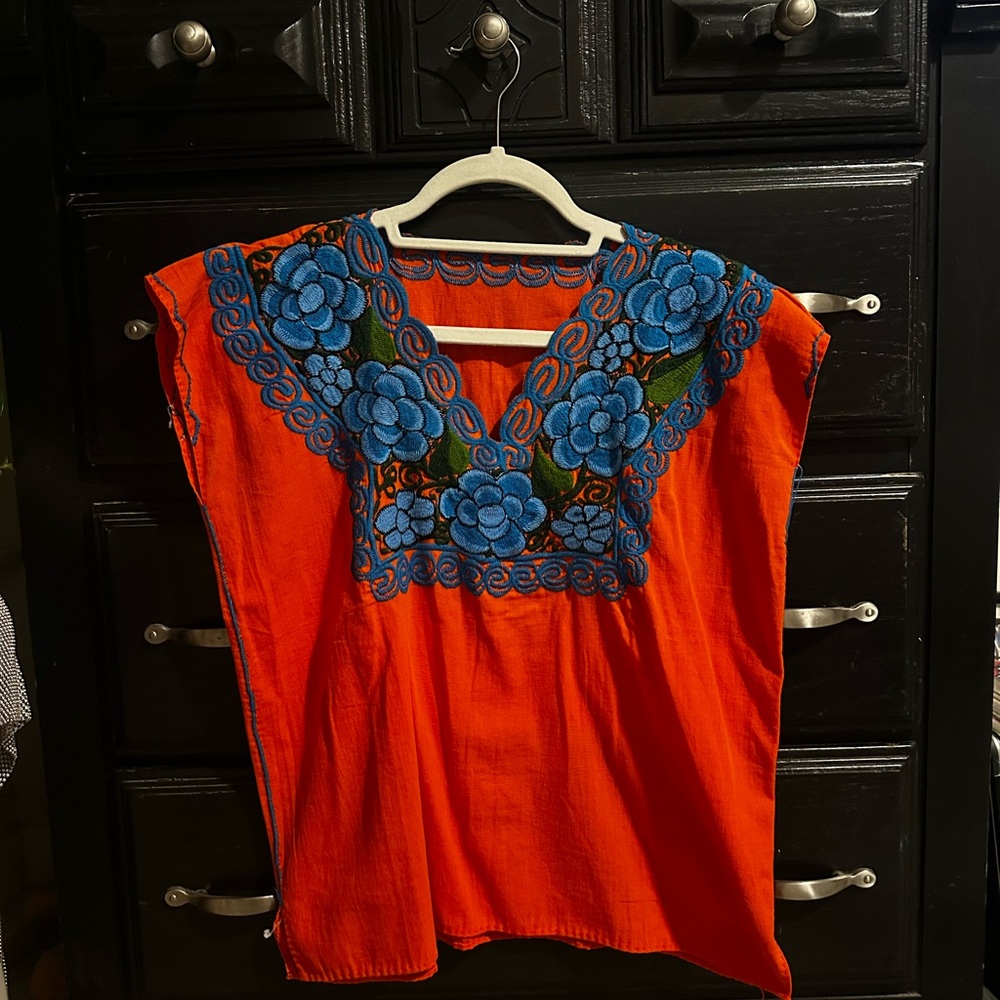 Vibrant Orange Top with Blue Floral Embroidery